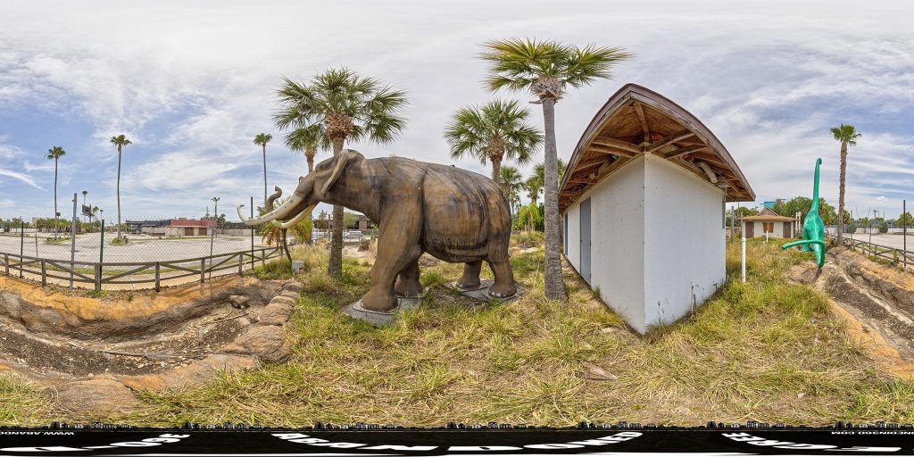 A 360-degree panoramic image captured at the abandoned Volcano Island Mini Golf Course in Orlando, Florida.