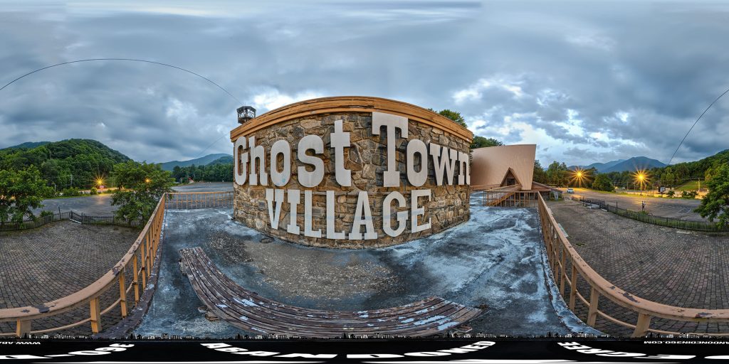 A 360-degree panoramic image in front of the Ghost Town Village sign at the abandoned North Carolina theme park. 