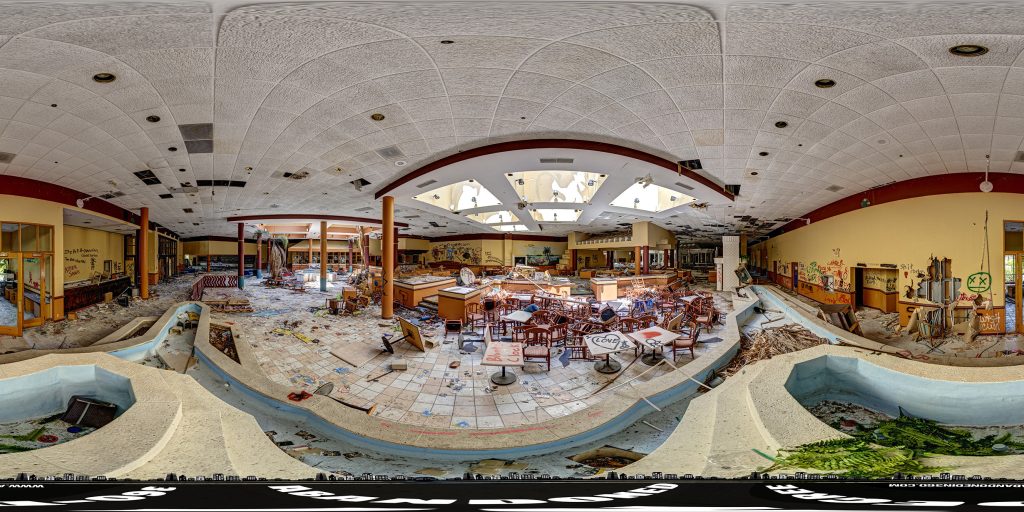 An equirectangular projection of a 360-degree panoramic image inside the abandoned Orlando Sun Resort and Convention Center in Kissimmee, Florida.